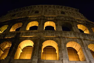 a view of the colosseum at night at Navona Sweet Loft in Rome