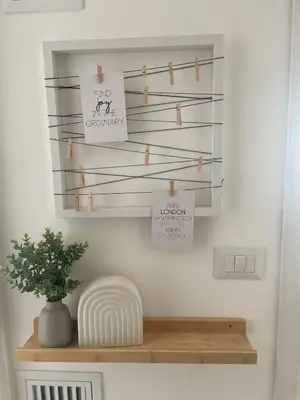 a shelf in a room with a plant on it at Appartamento 2 bagni, 2 camere a Piramide ostiense in Rome