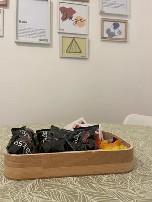 a wooden box filled with clothes sitting on a bed at Appartamento 2 bagni, 2 camere a Piramide ostiense in Rome