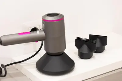 a black and grey hair dryer on a counter at TRASTEVERE PALACE GUEST House in Rome