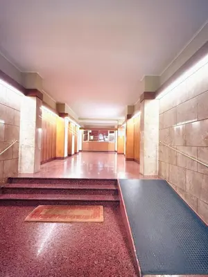 an empty hallway with stairs in a building at TRASTEVERE PALACE GUEST House in Rome