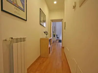 a hallway of a home with a hard wood floor at Suite Cernaia Holidays in Rome