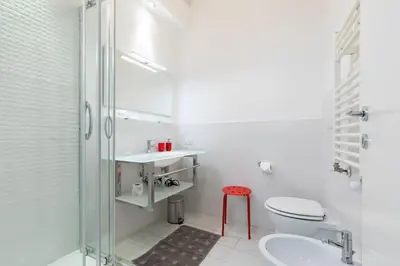a bathroom with a toilet and a sink and a shower at Suite Boschetto Holidays in Rome