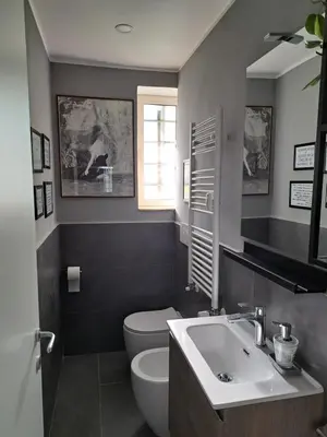 a bathroom with a white toilet and a sink at Appartamento Prenestina 74 in Rome
