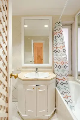 a bathroom with a sink and a tub and a mirror at Campo de Fiori - Casa Storica 4bdr con Terrazza in Rome