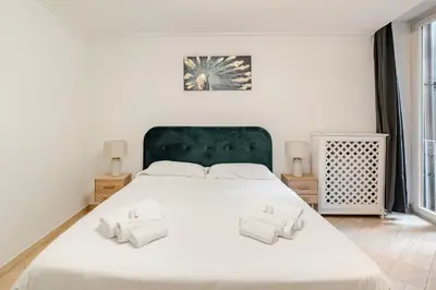a bedroom with a large white bed with two pillows at Campo de Fiori - Casa Storica 4bdr con Terrazza in Rome