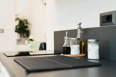 a kitchen counter with two bottles of milk on it at Maison Salvia in Rome