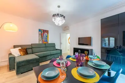 a living room with a table and a couch at Casa degli Dei in Rome