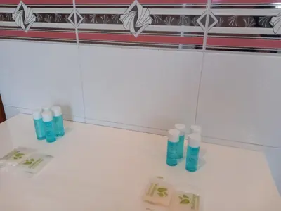 a group of bottles sitting on a counter in a bathroom at St Peter's view penthouse 300 mt metro A stop in Rome