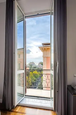 a large window with a view of a city at Migliori Collection Suites Via Veneto in Rome