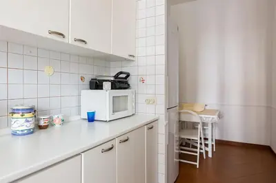 a kitchen with a white counter top with a microwave at Via Veneto e La Dolce Vita in Rome