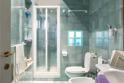 a bathroom with a toilet and a shower at Via Veneto e La Dolce Vita in Rome