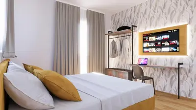 a hotel room with a bed and a desk at NeW!The Place Vaticano 278 guest house in Rome