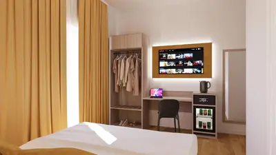 a bedroom with a bed and a desk and a television at NeW!The Place Vaticano 278 guest house in Rome