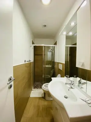 a bathroom with a sink and a toilet and a shower at Stephany's Guesthouse in Rome
