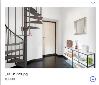 a living room with a spiral staircase in a room at Andreoli 2 apartment Rooftop in Rome