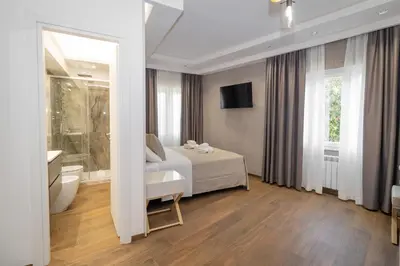 a hotel room with a bed and a bathroom at La Genziana in Rome