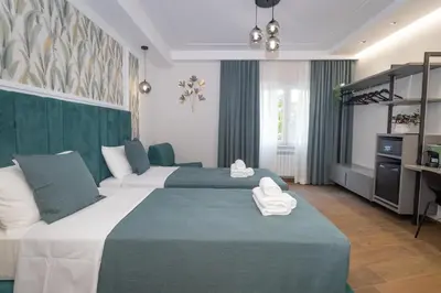 a hotel room with two beds with towels on them at La Genziana in Rome