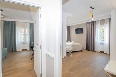 a room with a bed and a room with a mirror at La Genziana in Rome