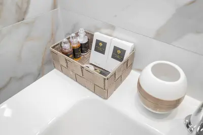 a box of essential oils sitting on a table in a bathroom at La Genziana in Rome
