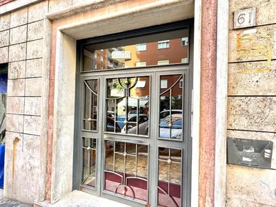 a window of a building with cars in it at Vespa s house 10 minuti Musei Vaticani in Rome
