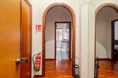 a hallway with an archway and a fire hydrant in a room at Vespa s house 10 minuti Musei Vaticani in Rome