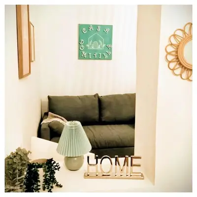 a mirror in a living room with a couch at Casa Domitilla in Rome