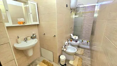 a bathroom with a sink and a toilet and a shower at A Casa Simpatia Vaticano in Rome