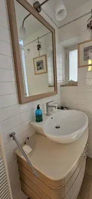 a bathroom with a sink and a mirror at Casa Capponi - A San Pietro in Rome