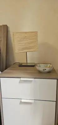 a lamp on top of a dresser with a bowl on it at Casa Capponi - A San Pietro in Rome