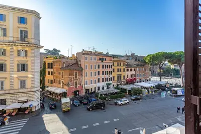an overhead view of a city street with cars and buildings at iFlat Colosseum & Monti Cozy Bright Dream in Rome
