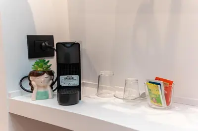 a black phone sitting on top of a shelf at Il Melograno - Casa Palmeri in Rome