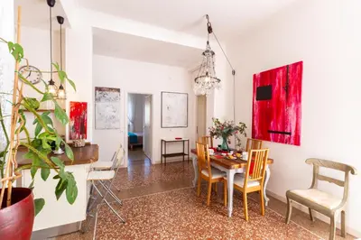 a dining room with a table and chairs at Sunny Charming 3 BDR, 3BATH Home in Rome