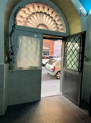 an entrance to a building with an open door at Fenty Home 2 San Lorenzo in Rome