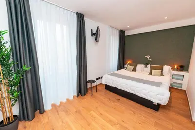 a bedroom with a bed and a large window at Il Mandorlo - Casa Palmeri in Rome