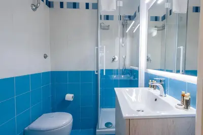 a bathroom with a toilet and a sink and a shower at Elegantis Dimora dell'Architetto in Campo de' Fiori With private terrace in Rome