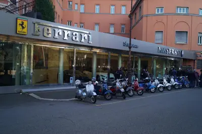 a row of scooters parked in front of a store at Caterina One o One - Embassy Apartment in Rome