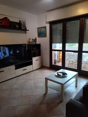 a living room with a tv and a coffee table at La Casa Vicino a Tutto in Rome