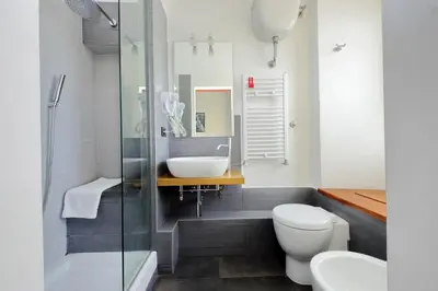 a bathroom with a sink and a toilet and a shower at Silvano's Home In Rome in Rome