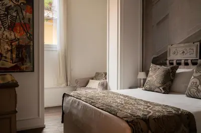 a bedroom with a bed and a window at BDB Rooms Trastevere in Rome