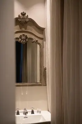 a bathroom with a sink and a mirror at BDB Rooms Trastevere in Rome