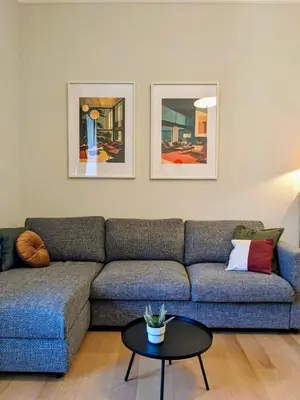 a living room with a couch and a table at Peaceful Roman Retreat in Rome
