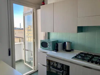 a kitchen with a counter top with a microwave at Spazioso Appartamento Vicino al Vaticano in Rome