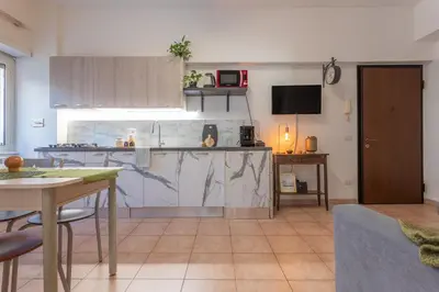 a kitchen with a table and a counter top at Hope Home in Rome