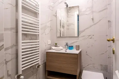 a bathroom with a sink and a mirror at iFlat Augustus Suite near Pantheon in Rome