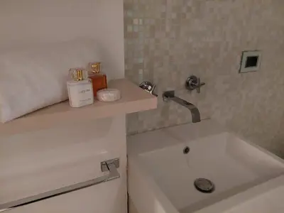 a bathroom with a sink and a bath tub at La Dimora di Roma in Rome