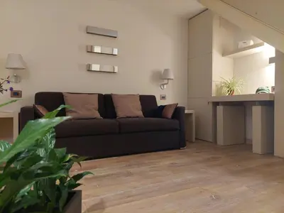 a living room with a couch and a table at La Dimora di Roma in Rome