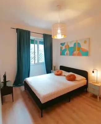 a bedroom with a bed with two towels on it at Art House in Rome