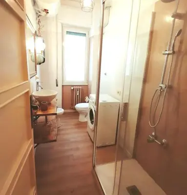 a bathroom with a shower and a toilet and a sink at Art House in Rome