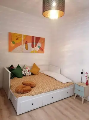a bedroom with a white bed with pillows on it at Art House in Rome